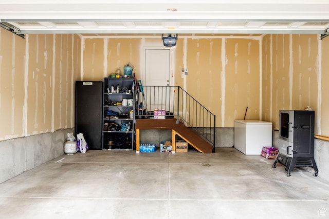 5229 W Armada Way, Herriman, UT 84096 - garage featuring refrigerator and a garage door opener