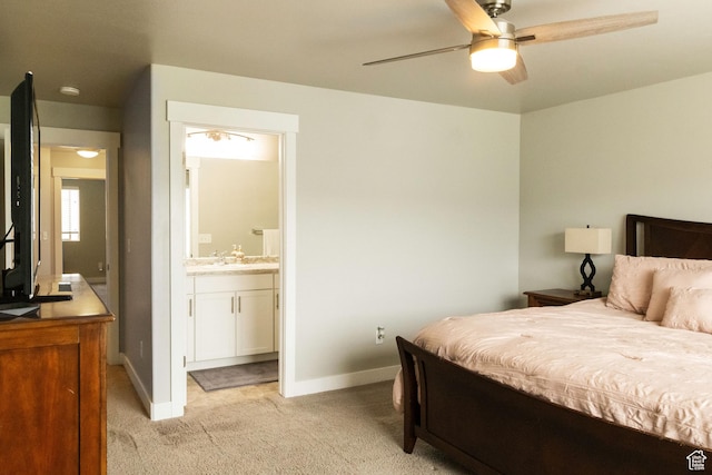 5229 W Armada Way, Herriman, UT 84096 - bedroom featuring baseboards, a sink, ensuite bathroom, and light carpet