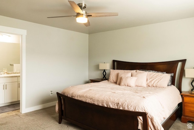 5229 W Armada Way, Herriman, UT 84096 - bedroom with baseboards, a ceiling fan, connected bathroom, and light carpet