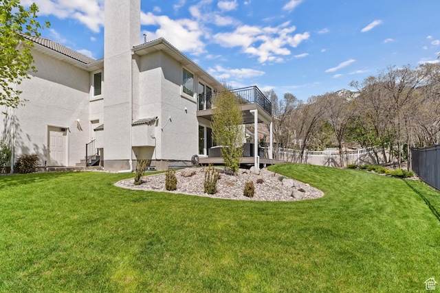 view of yard featuring a balcony