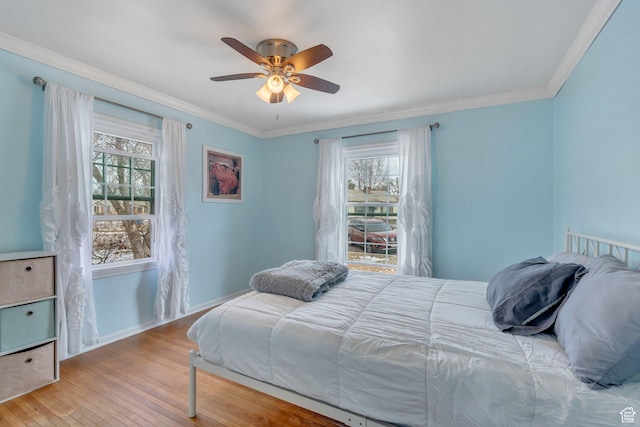 314 Harvard Cir, American Fork, UT 84003 - bedroom with multiple windows, wood finished floors, baseboards, and ornamental molding