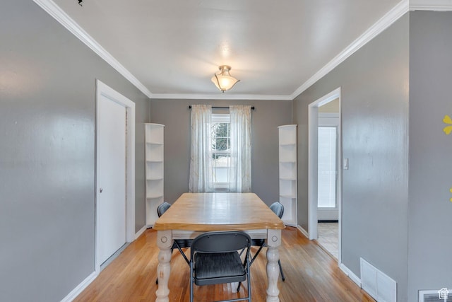 314 Harvard Cir, American Fork, UT 84003 - dining area featuring light wood-style floors, crown molding, and visible vents