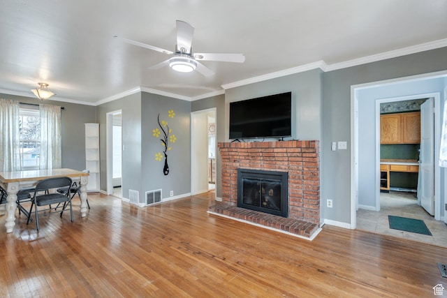 314 Harvard Cir, American Fork, UT 84003 - living area featuring a ceiling fan, baseboards, ornamental molding, visible vents, and wood finished floors