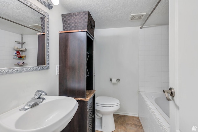 314 Harvard Cir, American Fork, UT 84003 - full bathroom with a sink, a textured ceiling, toilet, and visible vents