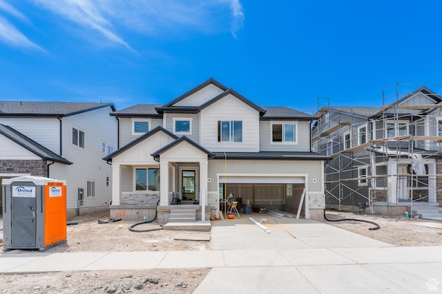 3729 W 950 N Unit 223, Lehi, UT 84043 - view of front facade featuring concrete driveway, board and batten siding, and an attached garage