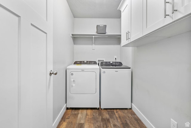 7465 N Cottage Ln, Eagle Mountain, UT 84005 - washroom featuring dark wood-style flooring, a textured ceiling, cabinet space, baseboards, and washer and clothes dryer