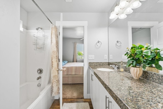 7465 N Cottage Ln, Eagle Mountain, UT 84005 - bathroom with vanity, ensuite bath, wood finished floors, and shower / bath combo with shower curtain