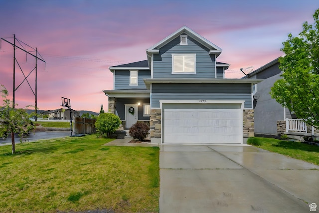7465 N Cottage Ln, Eagle Mountain, UT 84005 - view of front of house with concrete driveway, a front yard, an attached garage, and stone siding