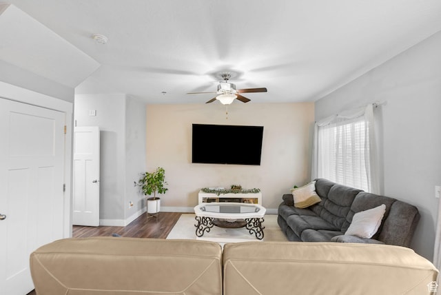 7465 N Cottage Ln, Eagle Mountain, UT 84005 - living area featuring dark wood-type flooring, a ceiling fan, and baseboards