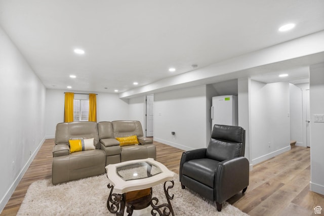 7465 N Cottage Ln, Eagle Mountain, UT 84005 - living room featuring recessed lighting, baseboards, and light wood-style floors