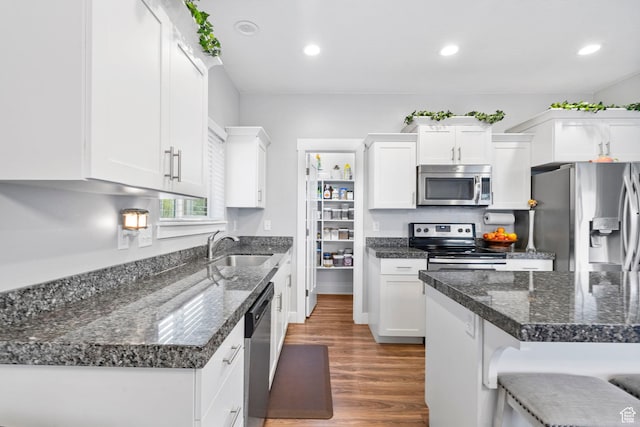 7465 N Cottage Ln, Eagle Mountain, UT 84005 - kitchen featuring a sink, appliances with stainless steel finishes, and white cabinets