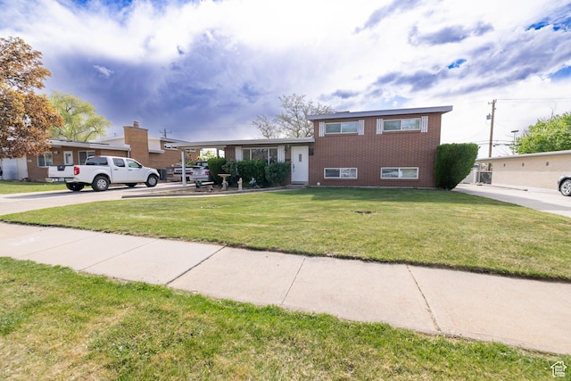 5393 S 700 E, South Ogden, UT 84405 - split level home featuring brick siding and a front lawn