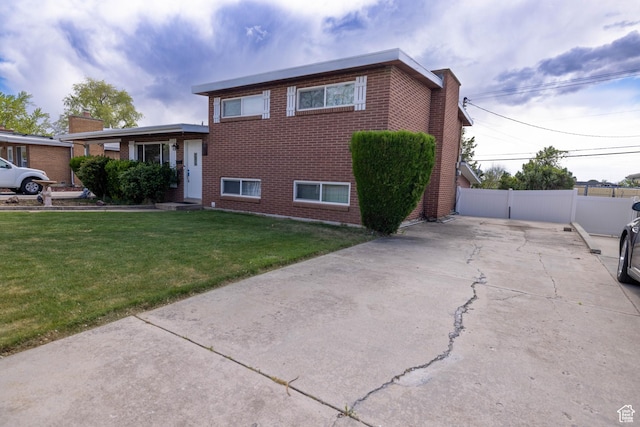 5393 S 700 E, South Ogden, UT 84405 - view of front of home featuring brick siding, fence, and a front yard