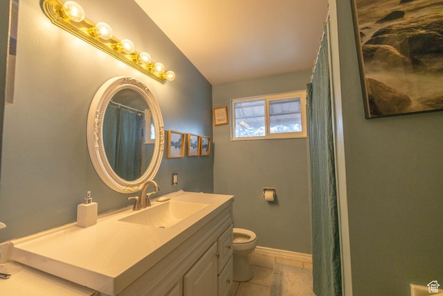 5393 S 700 E, South Ogden, UT 84405 - full bathroom featuring vanity, toilet, tile patterned floors, baseboards, and vaulted ceiling