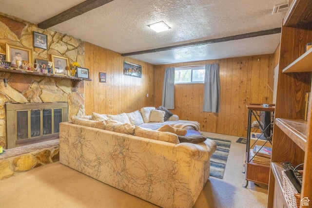 5393 S 700 E, South Ogden, UT 84405 - carpeted living room with wooden walls, a textured ceiling, a stone fireplace, and beam ceiling