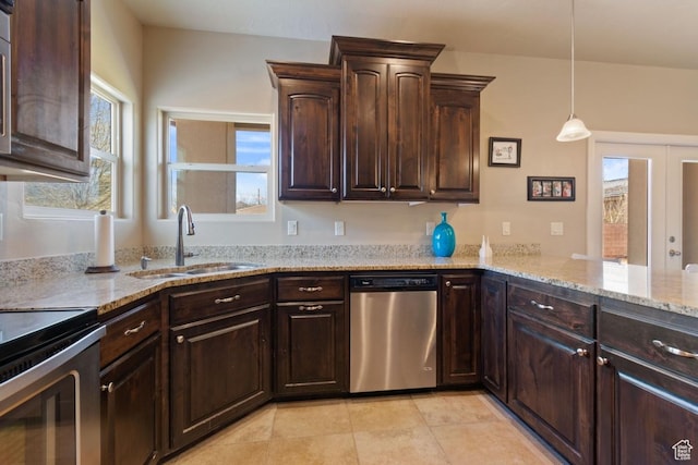 430 N 3450 W, Hurricane, UT 84737 - kitchen featuring stainless steel appliances, a sink, dark brown cabinetry, light stone countertops, and pendant lighting