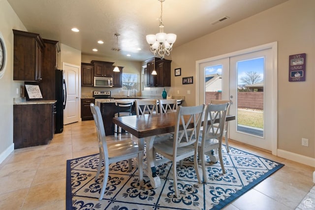 430 N 3450 W, Hurricane, UT 84737 - dining area featuring a chandelier, baseboards, recessed lighting, light tile patterned floors, and french doors