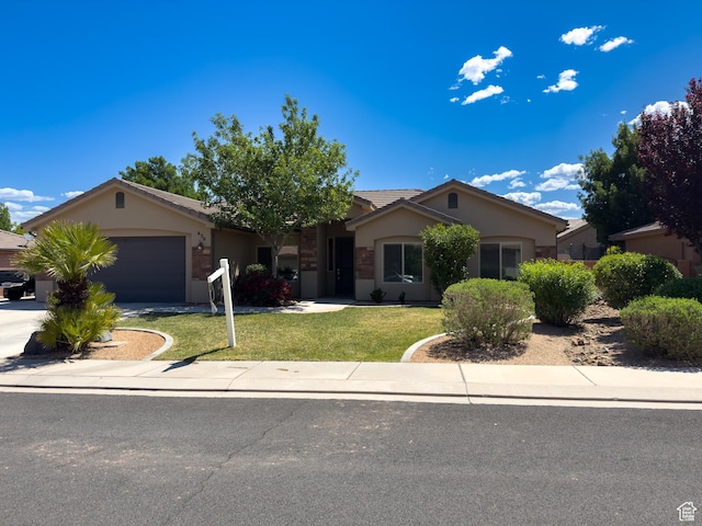 430 N 3450 W, Hurricane, UT 84737 - single story home featuring an attached garage, stucco siding, a front yard, concrete driveway, and a tile roof