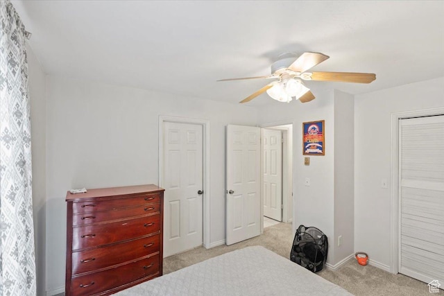 1554 S Monroe Blvd Unit F4, Ogden, UT 84404 - bedroom featuring baseboards, light carpet, and a ceiling fan