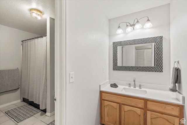 1554 S Monroe Blvd Unit F4, Ogden, UT 84404 - full bathroom with a shower with curtain, baseboards, tile patterned flooring, and vanity