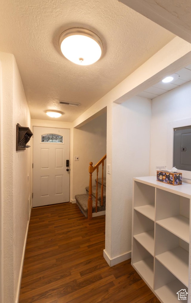 450 Hillside Pl, Cedar City, UT 84721 - hallway with a textured ceiling, visible vents, stairway, baseboards, and dark wood-type flooring
