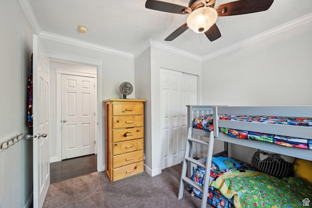 8551 S Laurel Oak Dr W, West Jordan, UT 84081 - bedroom with crown molding, a closet, dark carpet, baseboards, and a ceiling fan