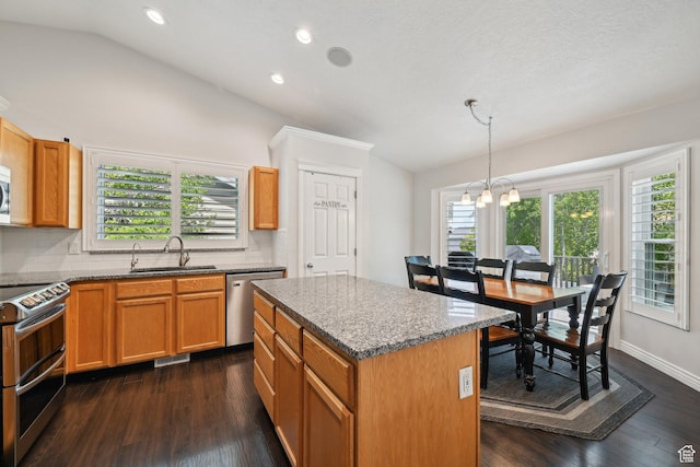 8551 S Laurel Oak Dr W, West Jordan, UT 84081 - kitchen with plenty of natural light, a sink, appliances with stainless steel finishes, and lofted ceiling