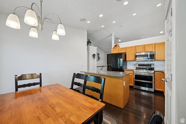 8551 S Laurel Oak Dr W, West Jordan, UT 84081 - kitchen featuring dark wood-style flooring, a kitchen island, recessed lighting, appliances with stainless steel finishes, and vaulted ceiling