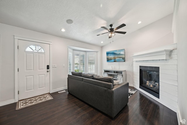 8551 S Laurel Oak Dr W, West Jordan, UT 84081 - living room with dark wood-style flooring, a glass covered fireplace, baseboards, ceiling fan, and recessed lighting