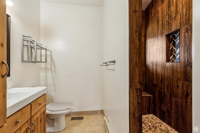 1586 Splendor Valley Rd, Kamas, UT 84036 - full bath with vanity, baseboard heating, toilet, tile patterned flooring, and a tile shower