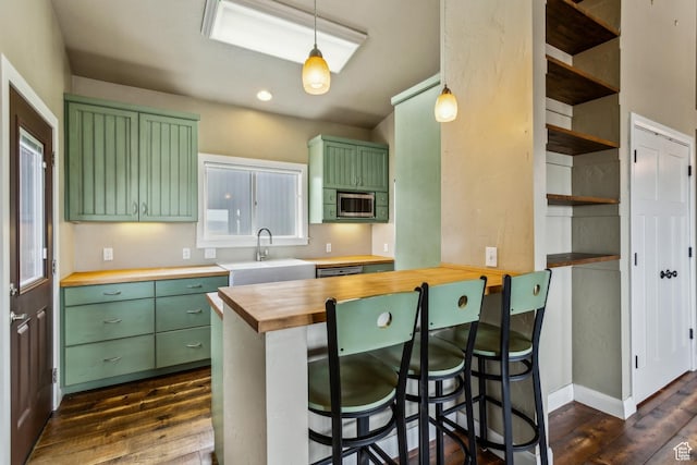 1586 Splendor Valley Rd, Kamas, UT 84036 - kitchen featuring wooden counters, green cabinets, a sink, stainless steel microwave, and dark wood finished floors