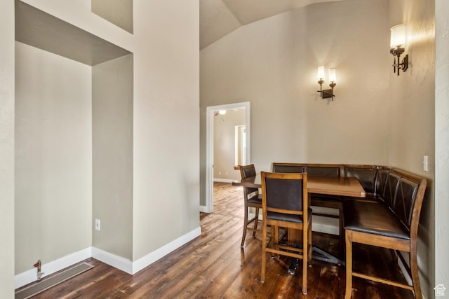 1586 Splendor Valley Rd, Kamas, UT 84036 - dining space featuring wood finished floors, baseboards, and high vaulted ceiling