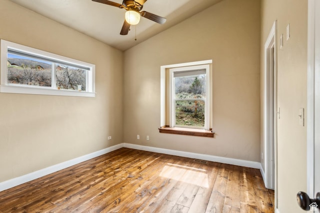 1586 Splendor Valley Rd, Kamas, UT 84036 - empty room featuring healthy amount of natural light, lofted ceiling, hardwood / wood-style floors, and baseboards