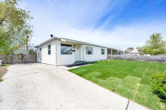 5756 S 4540 W, Kearns, UT 84118 - ranch-style house with a gate, fence, a front yard, and concrete driveway