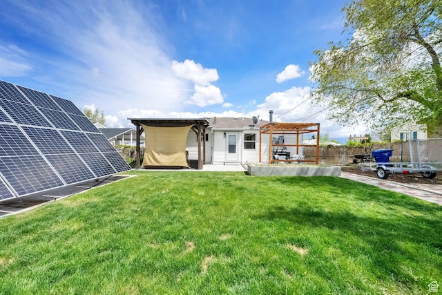 5756 S 4540 W, Kearns, UT 84118 - back of house featuring a yard, a pergola, fence, and solar panels