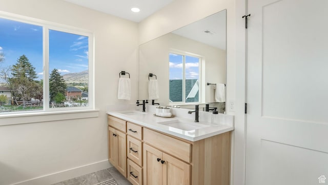 2298 E Parkside Cir S, South Ogden, UT 84403 - full bathroom featuring a sink, baseboards, double vanity, and visible vents