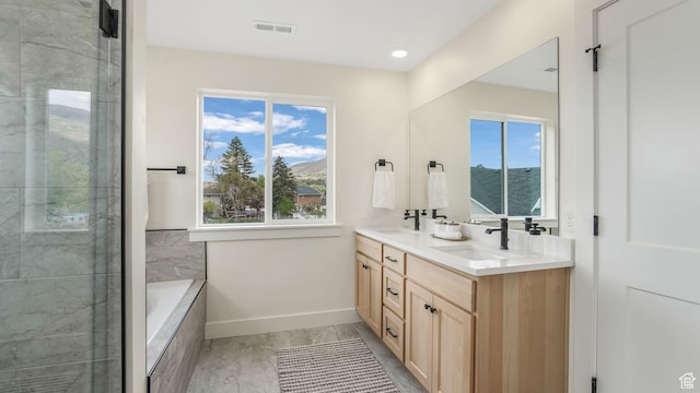 2298 E Parkside Cir S, South Ogden, UT 84403 - bathroom with a sink, baseboards, double vanity, and visible vents