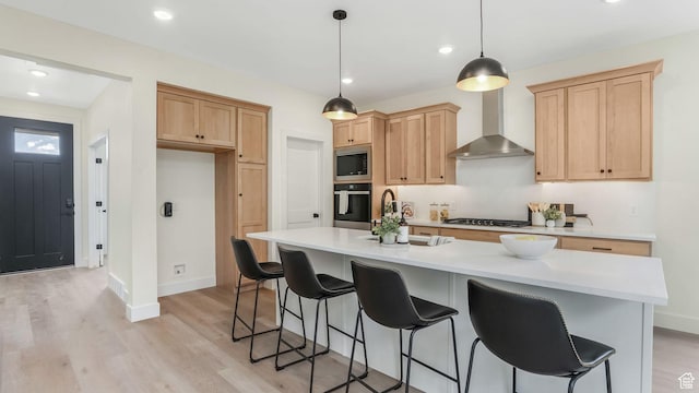 2298 E Parkside Cir S, South Ogden, UT 84403 - kitchen with baseboards, light wood-style flooring, wall chimney exhaust hood, and appliances with stainless steel finishes