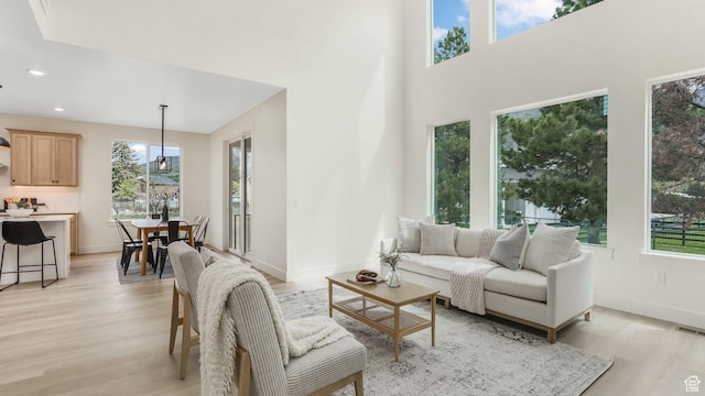 2298 E Parkside Cir S, South Ogden, UT 84403 - living room with recessed lighting, baseboards, light wood finished floors, and a wealth of natural light