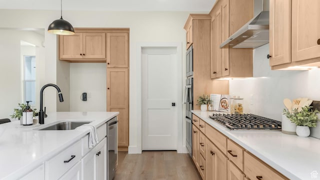 2298 E Parkside Cir S, South Ogden, UT 84403 - kitchen with light brown cabinetry, wall chimney range hood, light countertops, a sink, and appliances with stainless steel finishes