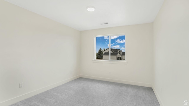 2298 E Parkside Cir S, South Ogden, UT 84403 - spare room with baseboards, visible vents, and light colored carpet