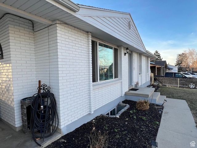 5676 S Wilderland Ln, Taylorsville, UT 84129 - view of home's exterior featuring brick siding