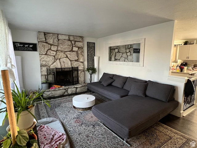 5676 S Wilderland Ln, Taylorsville, UT 84129 - living area featuring wood finished floors and a fireplace