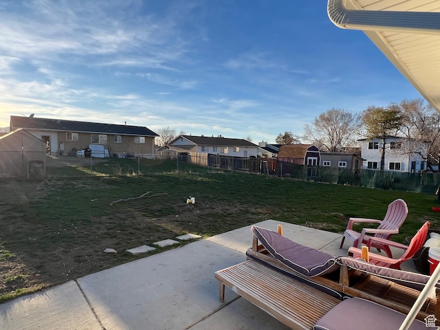 5676 S Wilderland Ln, Taylorsville, UT 84129 - view of patio / terrace featuring a residential view and a fenced backyard