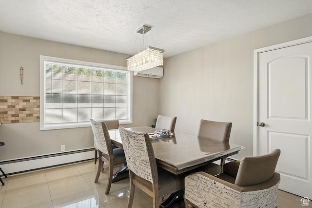 63 E Main, Bicknell, UT 84715 - dining space featuring an inviting chandelier, a wall unit AC, a baseboard heating unit, and light tile patterned flooring