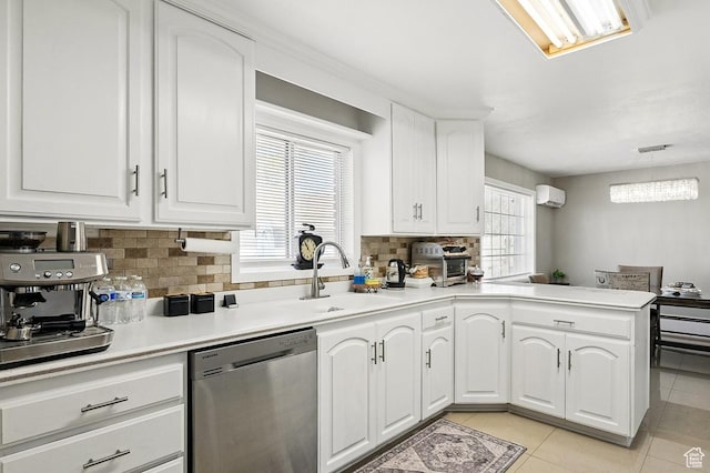 63 E Main, Bicknell, UT 84715 - kitchen featuring backsplash, a wall mounted air conditioner, dishwasher, a sink, and light tile patterned floors