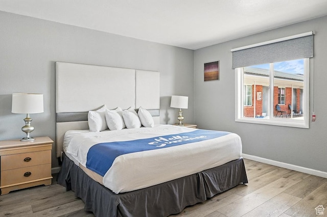 63 E Main, Bicknell, UT 84715 - bedroom featuring baseboards and light wood-style flooring