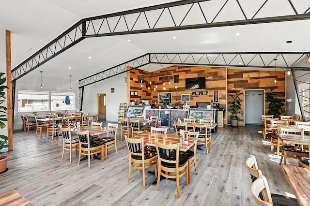 63 E Main, Bicknell, UT 84715 - dining space featuring wood walls, wood finished floors, and lofted ceiling