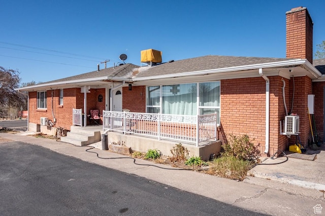 63 E Main, Bicknell, UT 84715 - single story home featuring brick siding, a chimney, and a porch