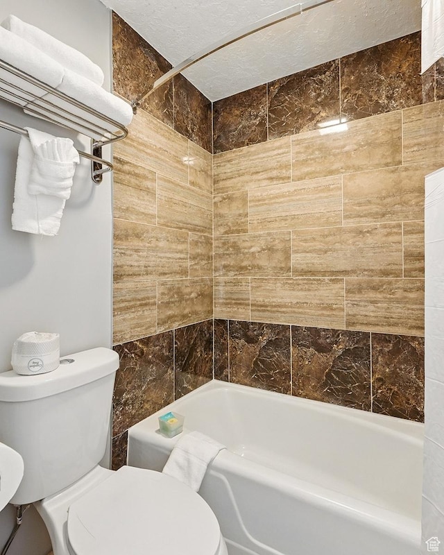 63 E Main, Bicknell, UT 84715 - full bath featuring toilet, a textured ceiling, and shower / tub combination
